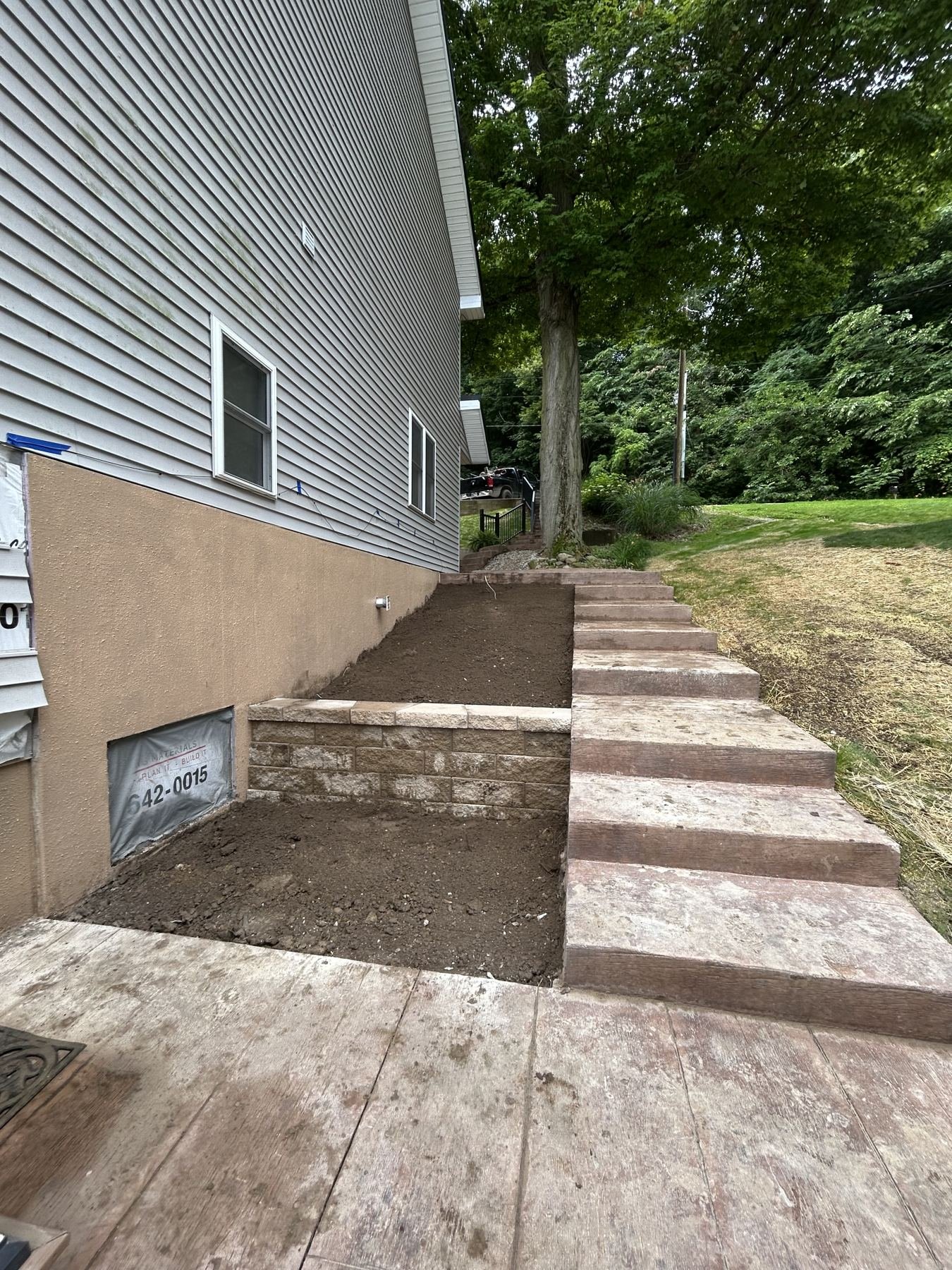 Outdoor steps and retaining wall block during construction